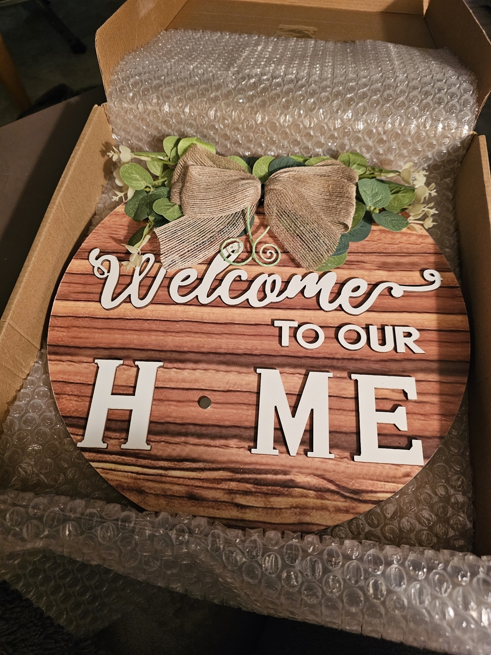 Welcome to Our Home Round Wooden Door Sign with Greenery Bow